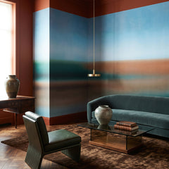 Rotko Clay wallpaper mural shown in living room with brown sofa and round table