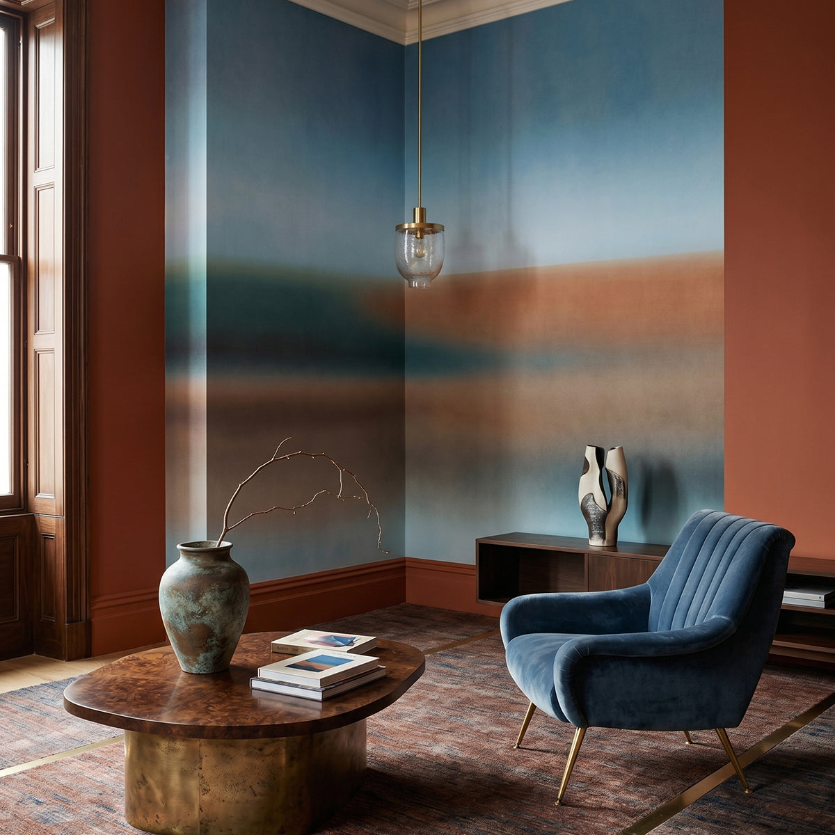 Rotko Clay wallpaper mural shown in living room with cream sofa and wood chair