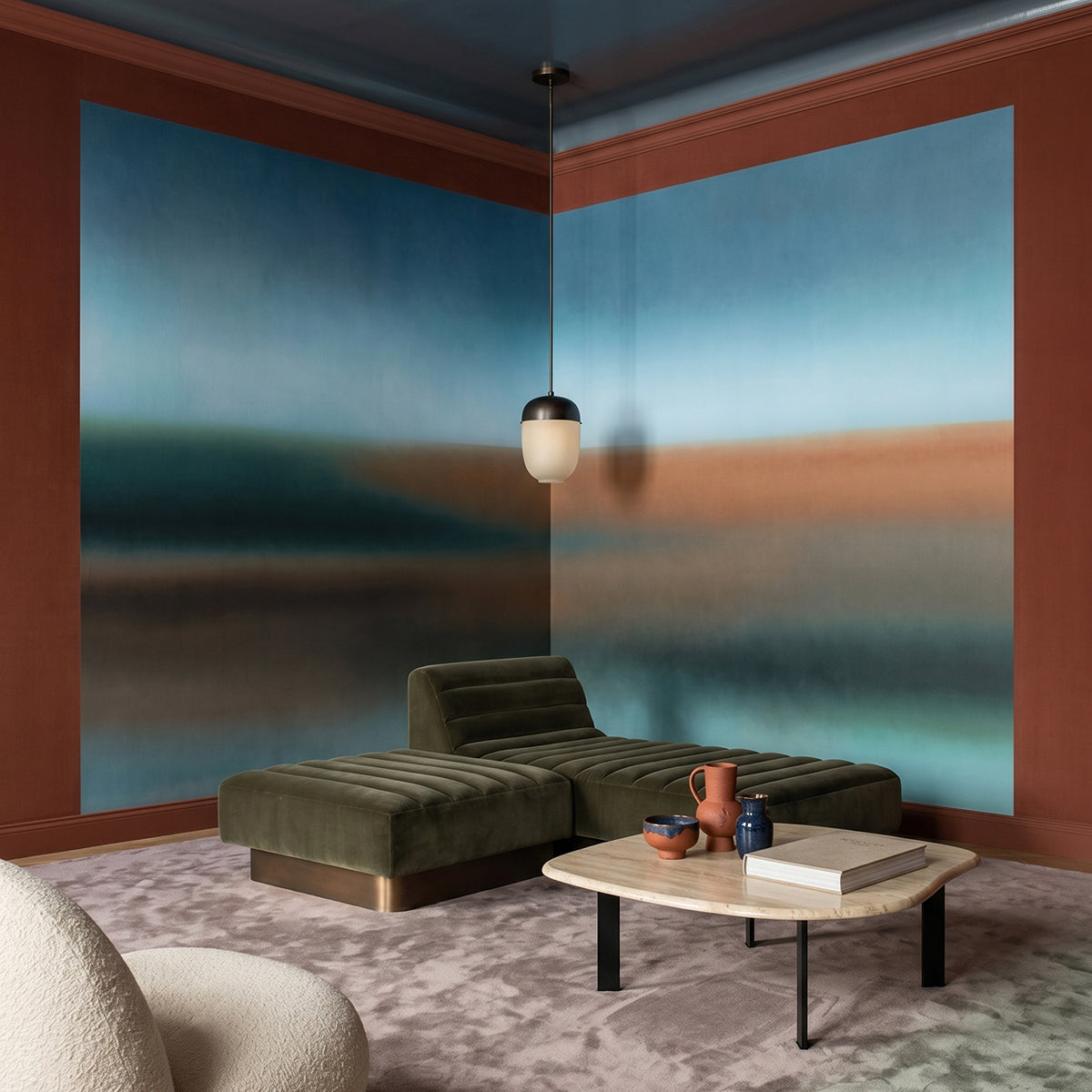 Rotko Clay wallpaper mural shown in living room with rust sofa