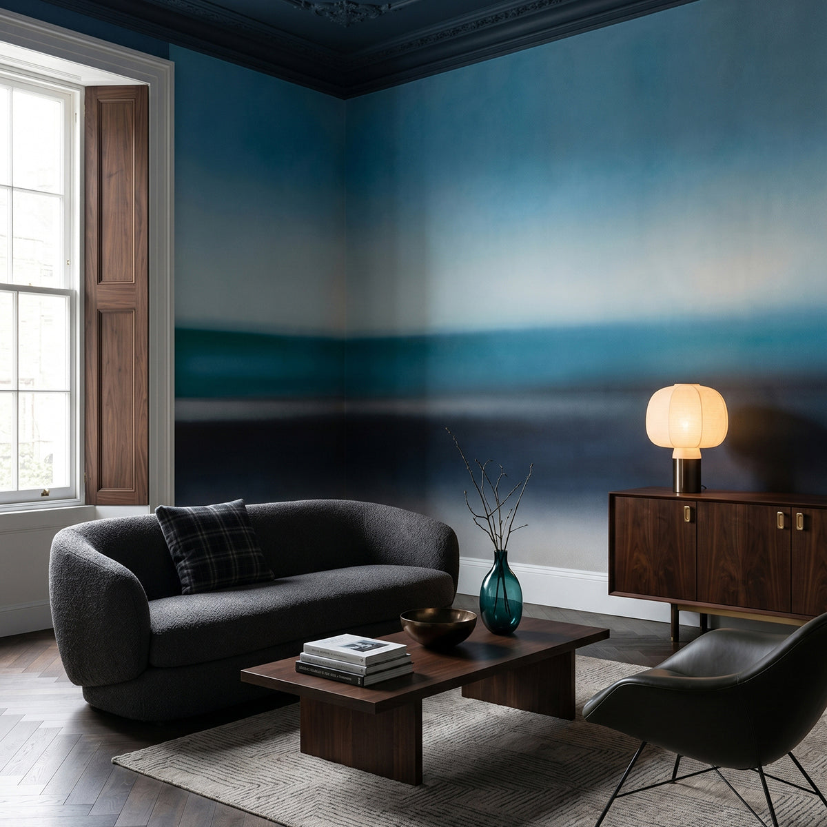 Rotko Veil wallpaper mural shown in living room with black sofa and black chair