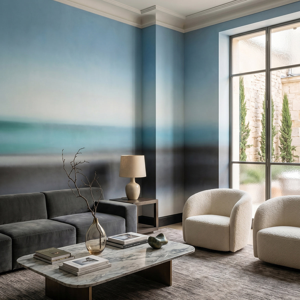 Rotko Veil wallpaper mural shown in living room with grey sofa and white armchairs