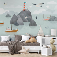 Seaside Stories wallpaper mural shown in a children's bedroom sofa