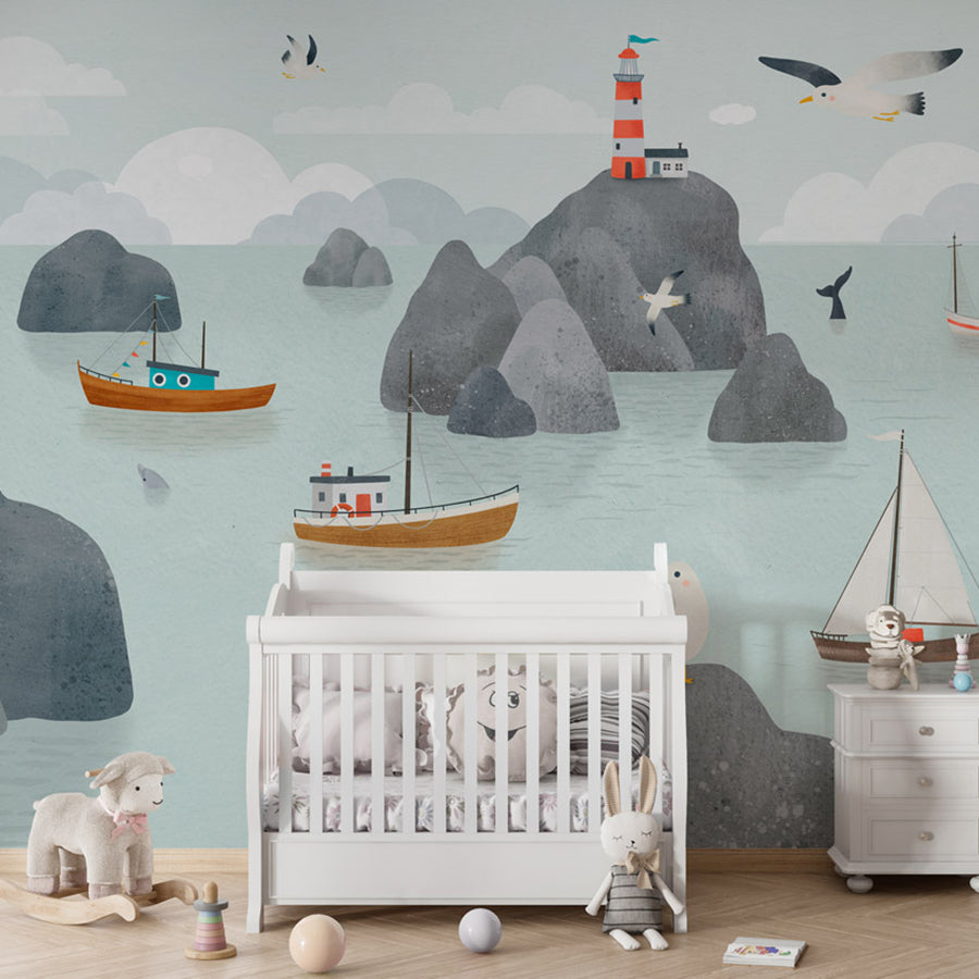 Seaside Stories wallpaper mural shown in a children's nursery crib