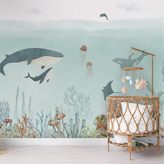 Sensational Sea – Blue wallpaper mural shown in a children's nursery crib