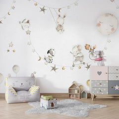 Sleeping Moon wallpaper mural shown in a children's bedroom armchair
