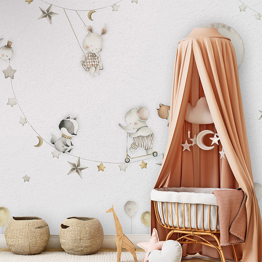 Sleeping Moon wallpaper mural shown in a children's nursery canopy crib