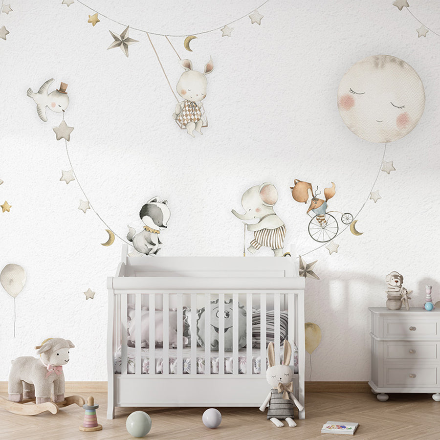 Sleeping Moon wallpaper mural shown in a children's nursery crib