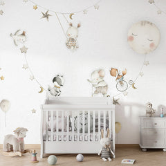 Sleeping Moon wallpaper mural shown in a children's nursery crib