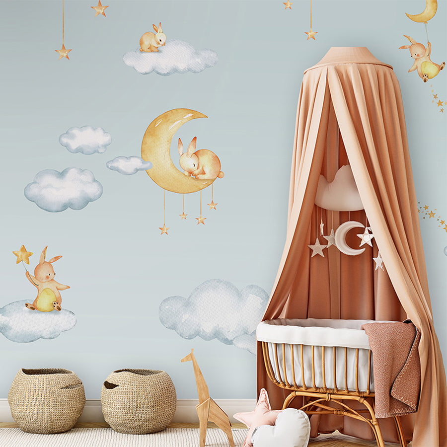 Sweet Dreams – Blue wallpaper mural shown in a children's nursery canopy crib