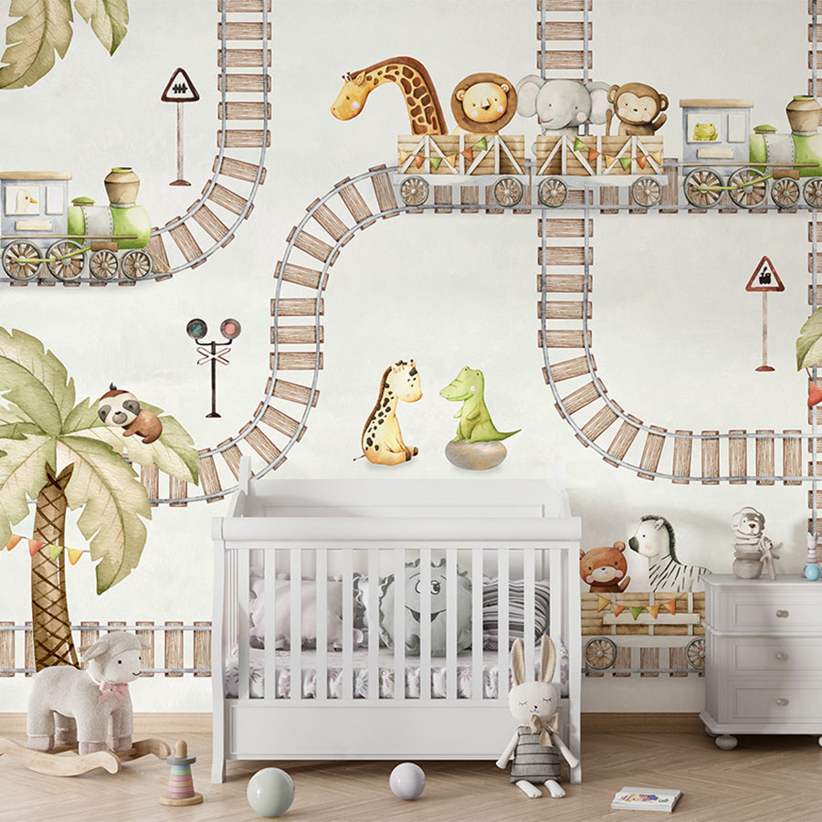Train Travels wallpaper mural shown in a children's nursery crib