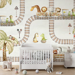 Train Travels wallpaper mural shown in a children's nursery crib