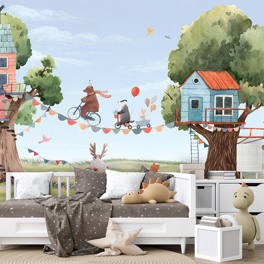 Treehouse Party wallpaper mural shown in a children's bedroom sofa