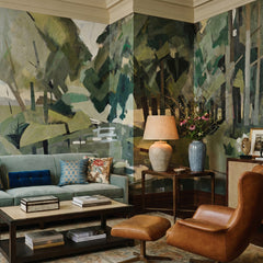Velvet Forest wallpaper mural shown in living room with blue sofa and leather chair
