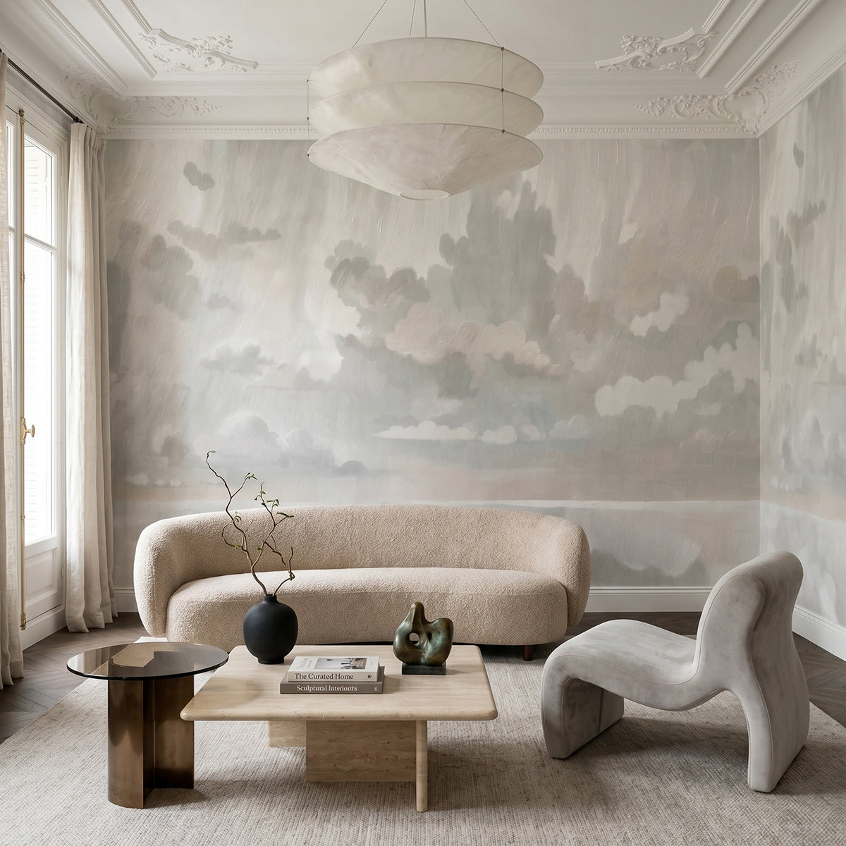 Velvet Smoke wallpaper mural shown in living room with curved sofa and white armchair