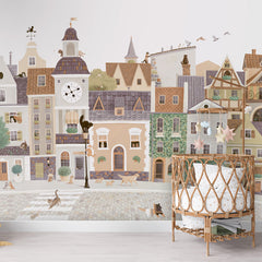 Village Cats wallpaper mural shown in a children's nursery crib