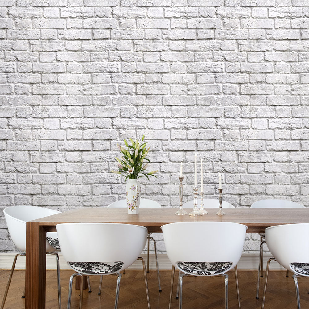 Chalky white brick effect wallpaper in dining room setting