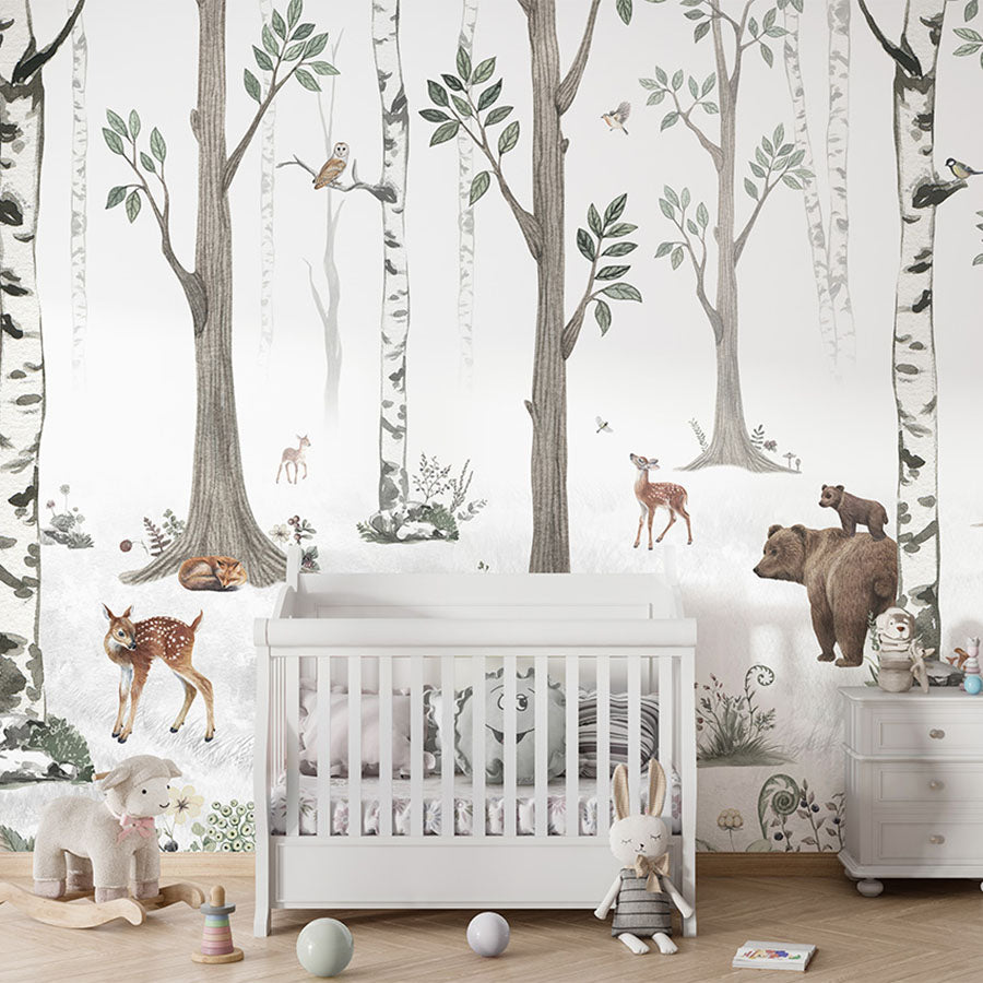 White Forest wallpaper mural in a nursery cot