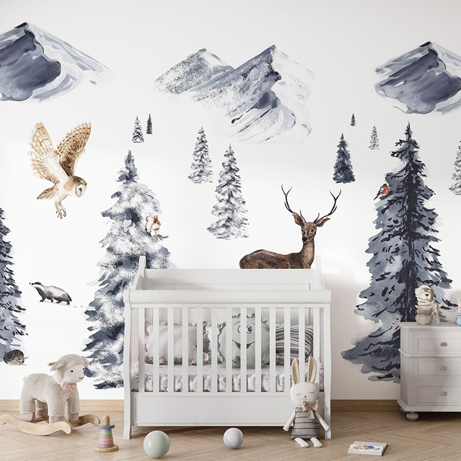 Winter Wonderland wallpaper mural in a nursery cot